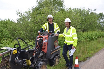 Narrow trench machine soft digging in verge with Openreach CEO Clive Selley