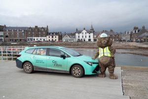 Go Fibre mascot with engineers car